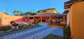Casa Mukau pé na areia